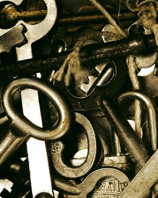 A pile of old metal keys of different shapes and sizes